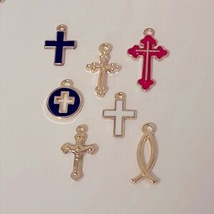 Set of 7 gold coloured religious charms